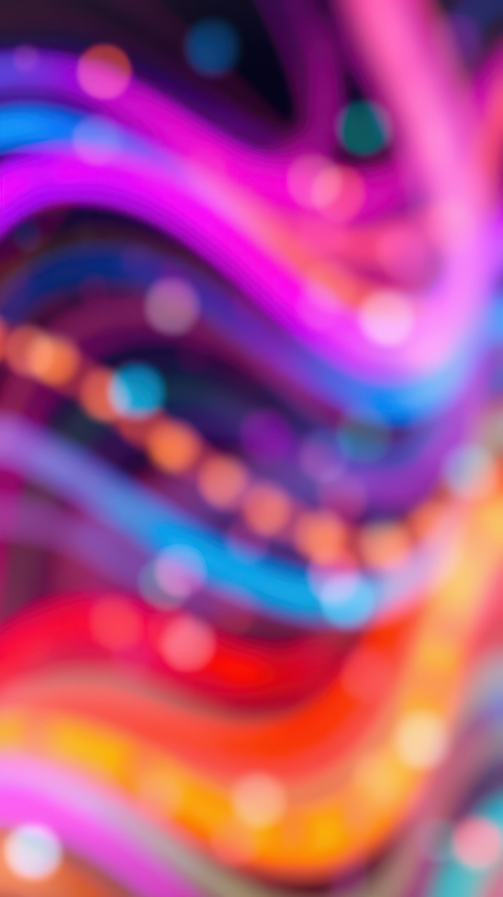 Colorful swirling patterns create a vibrant abstract art display during an art exhibit